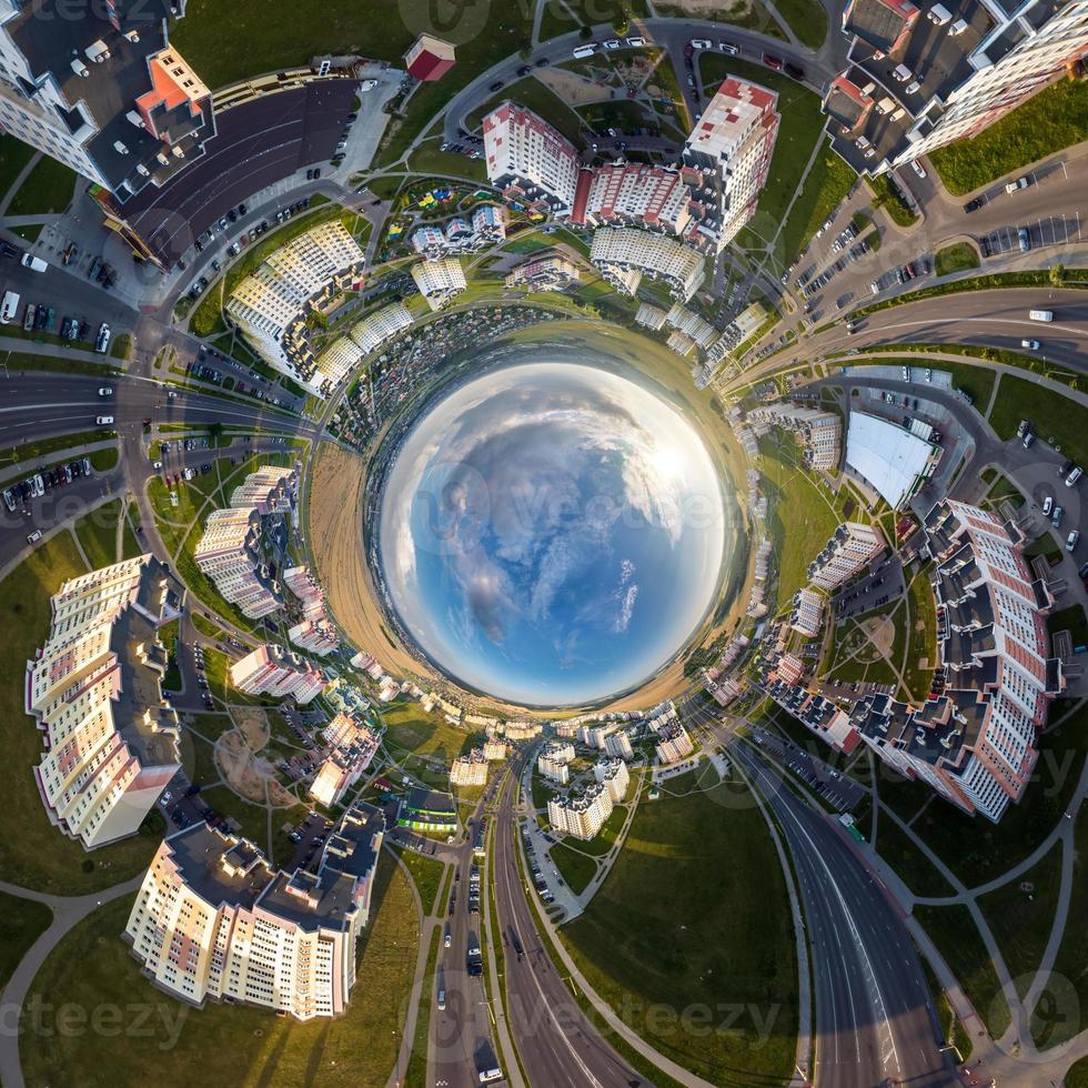 blue sphere inside overlooking old town, urban development, historic buildings and crossroads with cars. Transformation of spherical 360 panorama in abstract aerial view. photo