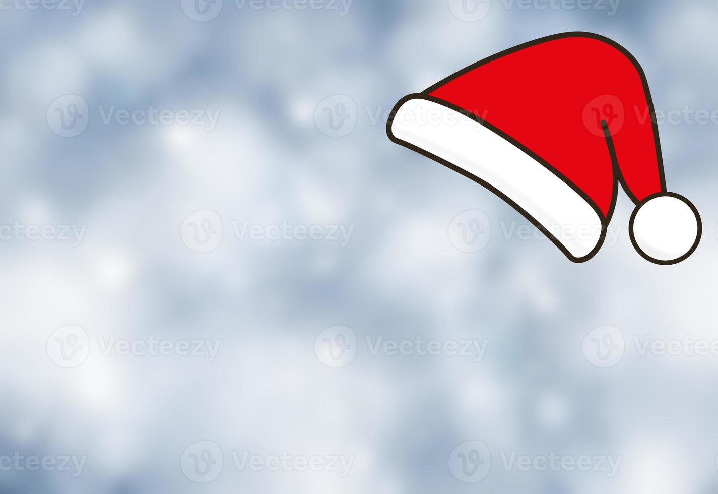 Blurred blue-gray background and red Santa Claus hat, Christmas and New Year. copy space. photo