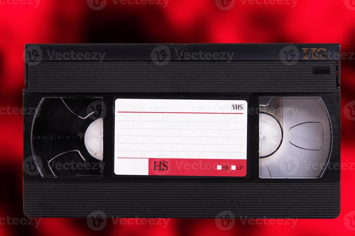 Video cassette, VHS, Pal Secam, Red-black blurred retro background. photo
