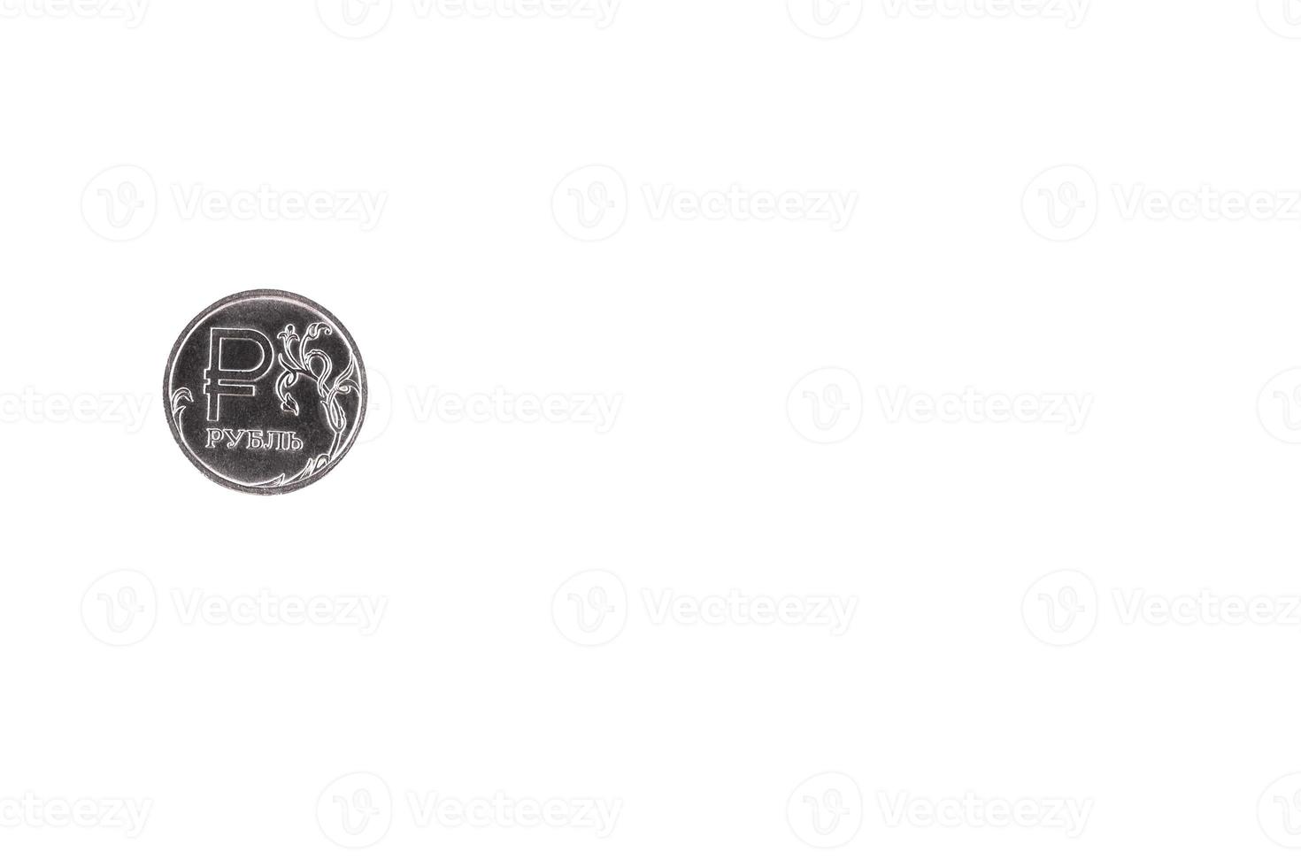 A metal coin with a denomination of one ruble. White isolated background. photo