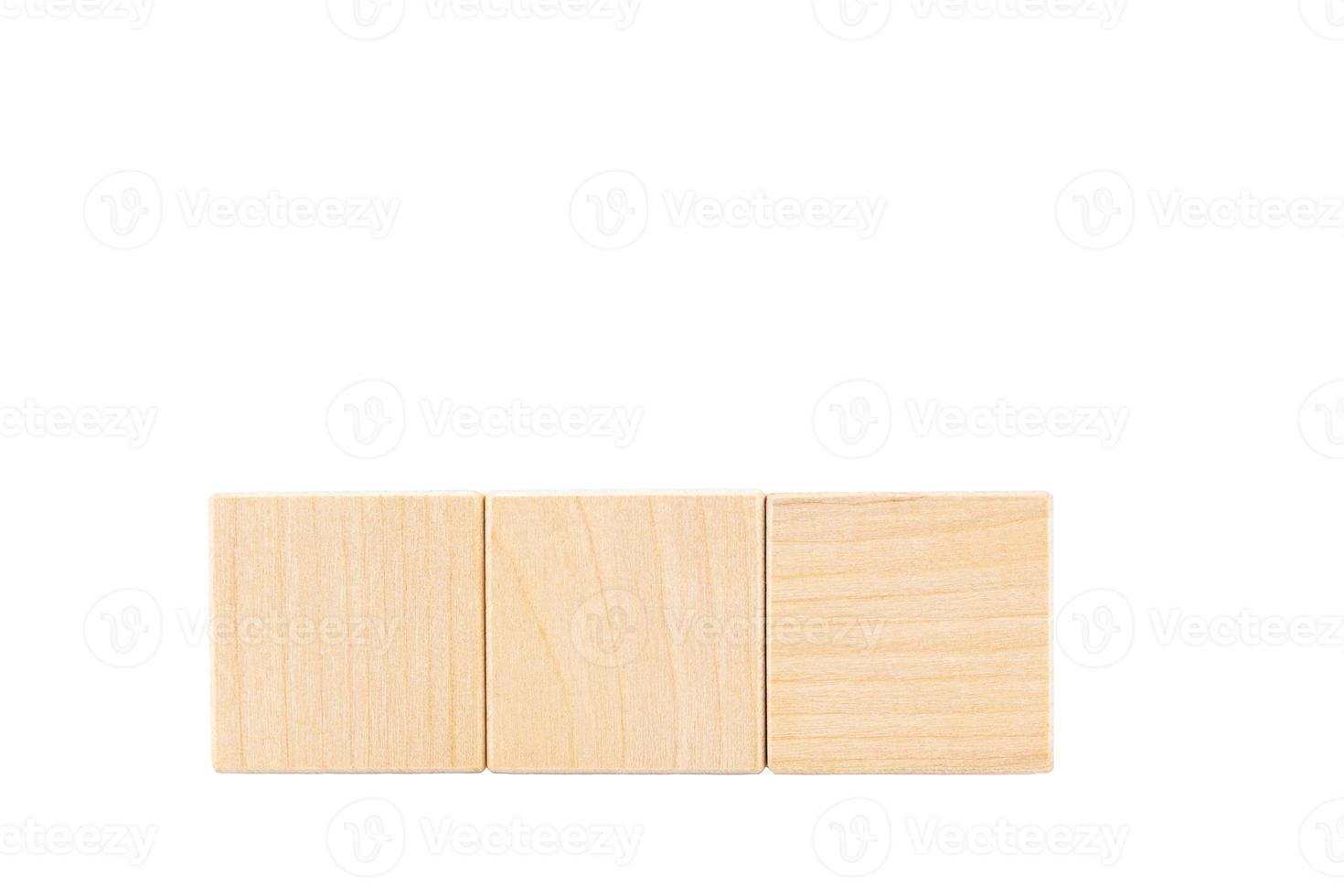 Three wooden cubes with space for text. White isolated background. copy space. photo