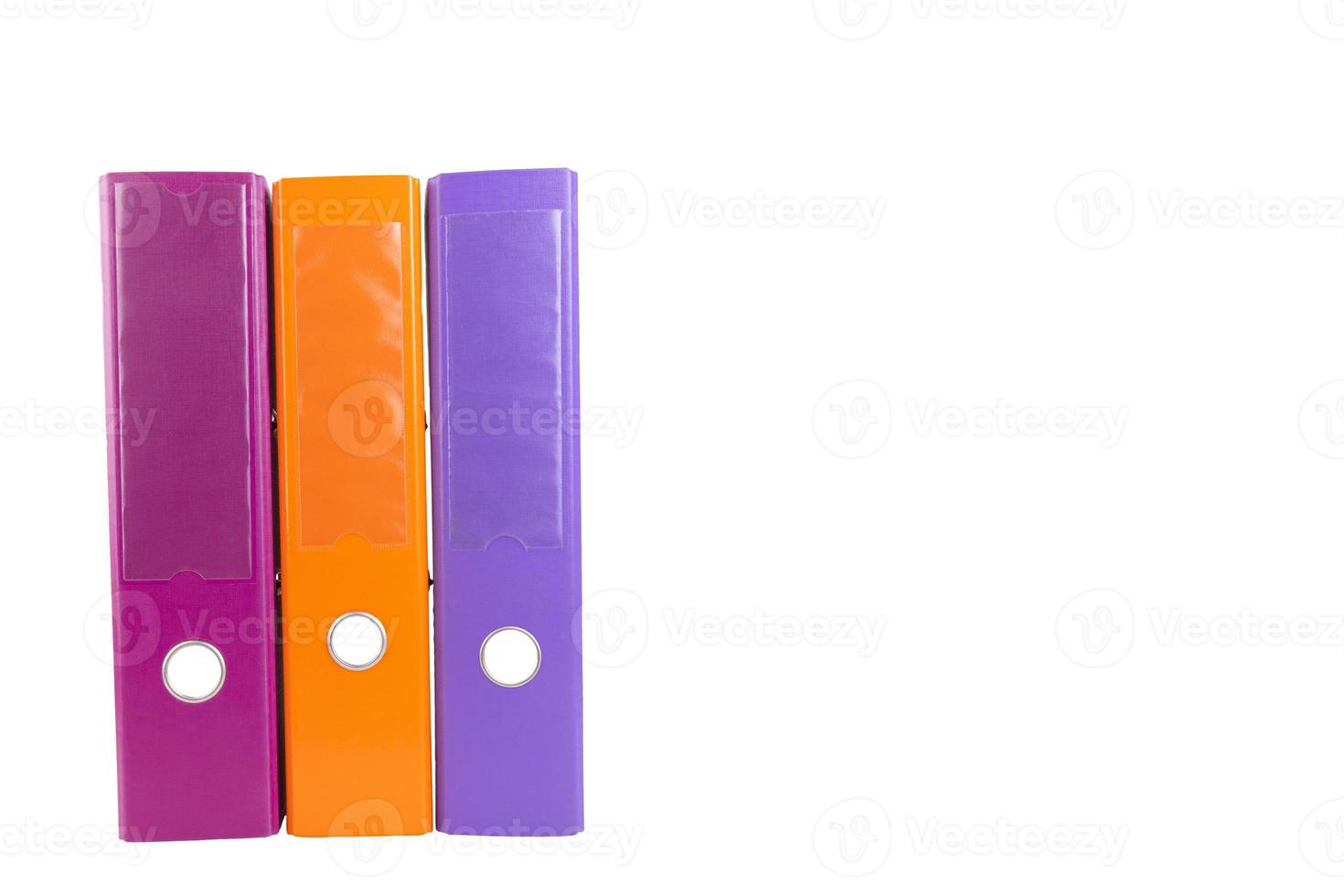 A set of three office folders in different colors. White isolated background. copy space. photo