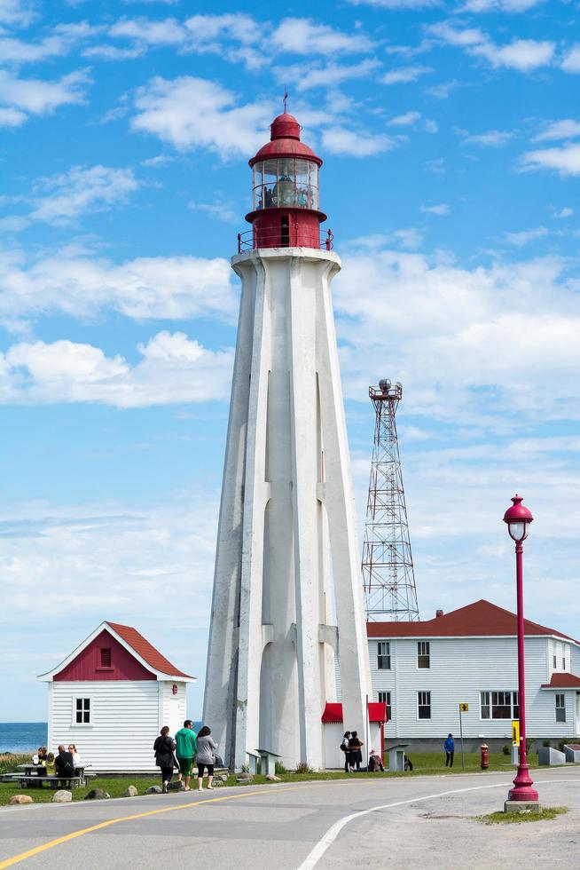 Rimouski, Canada - August 9, 2015-View of the Pointe au Pere lighthouse in the Gaspesie peninsula during a sunny day. photo