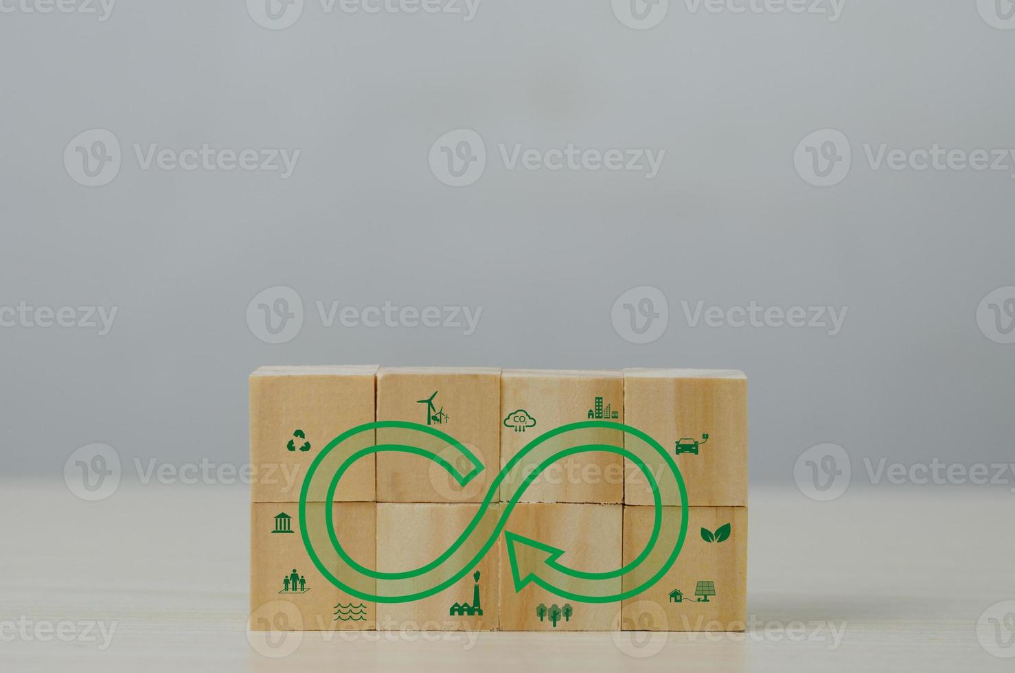 Net zero green eco infinity technology innovation eco carbon renewable energy sustainable development business Circular Economy concept with wood cube blocks. photo