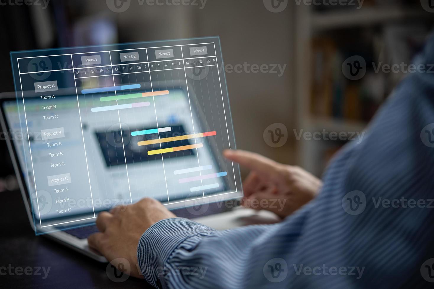 Project manager analyst working with computer in management system to progress planning and make report with KPI chart scheduling diagram.Corporate strategy for finance, sales, marketing. photo