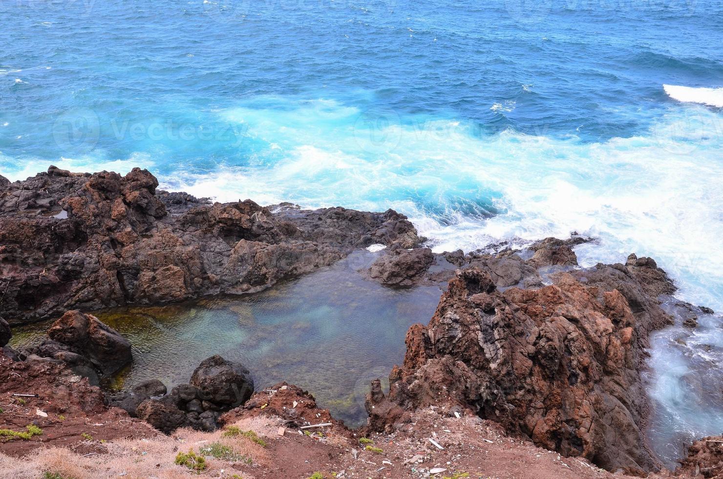 Rocky shoreline in summer photo