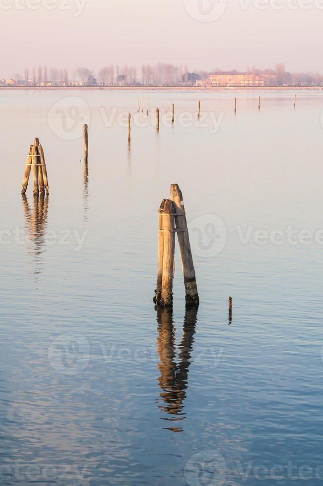 Wooden posts in the water 14790269 Stock Photo at Vecteezy