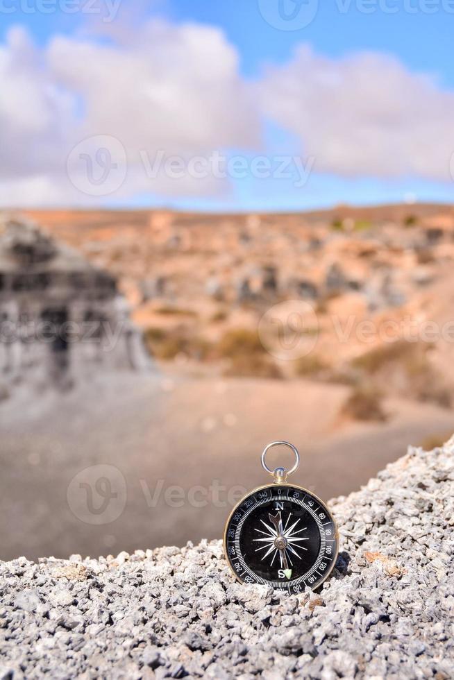 Compass in gravel photo