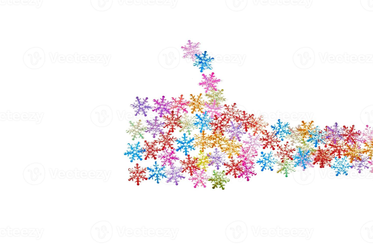 Thumbs up like gesture from colorful snowflakes, isolated white background photo