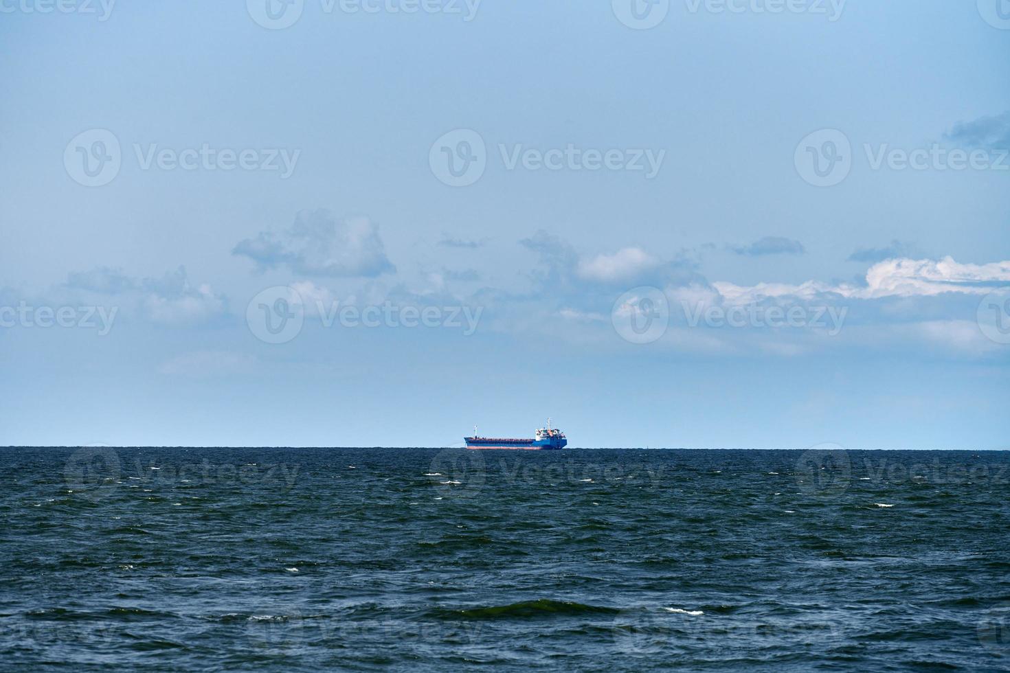 Container cargo ship freighter, import export trade logistic transportation, cargo ship in blue sea photo