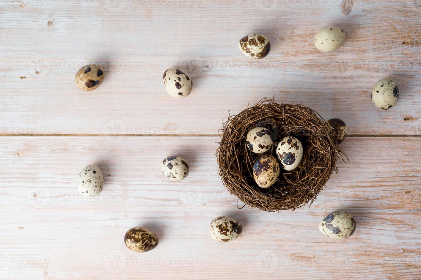 Easter flat lay with quail eegs in the nest.Rustic concept. April holidays photo