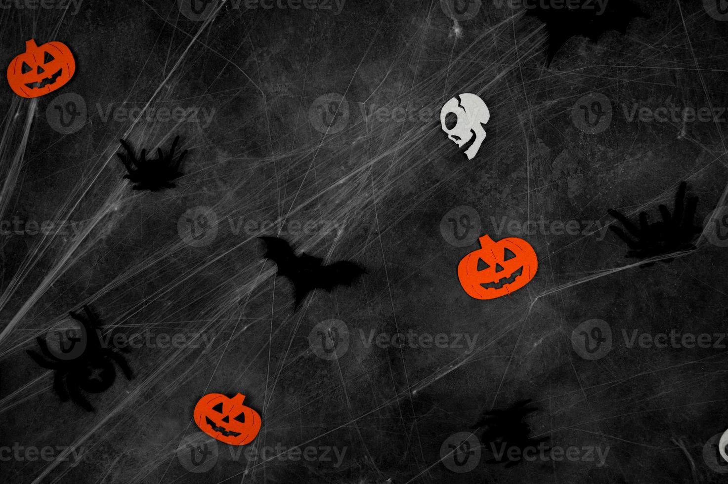 Spooky halloween background with bats,spiders,skulls and spider web. photo