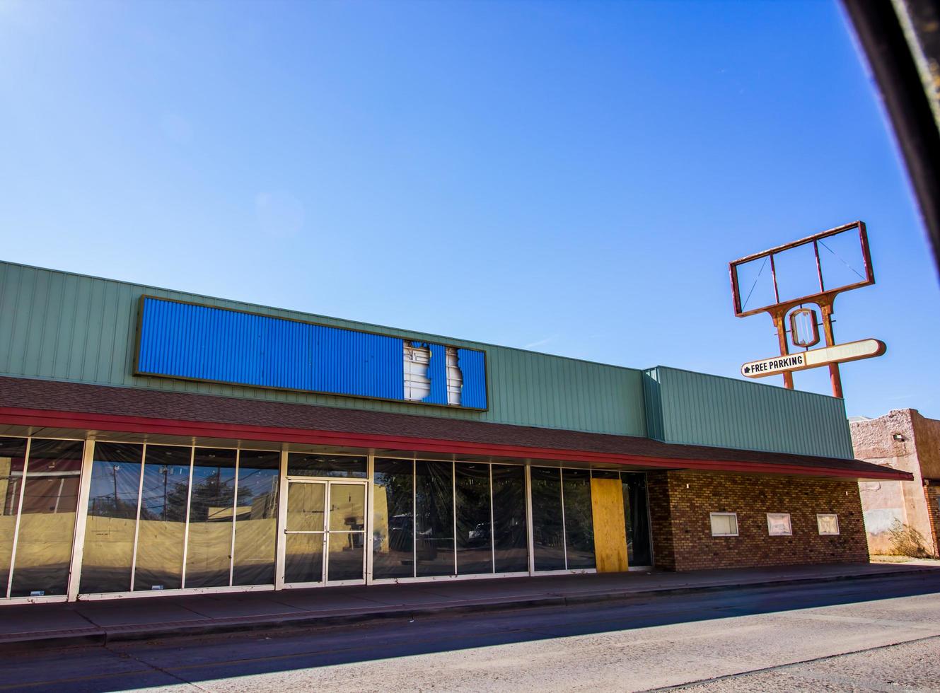 Abandoned Store Front Commercial Building In Distressed Area photo