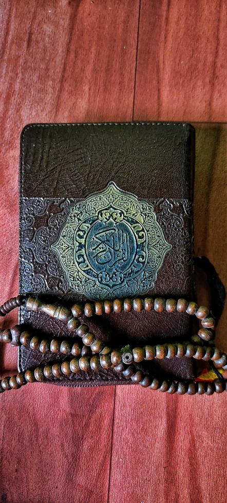 The portrait of tasbih and the Koran is very synonymous with Muslims photo