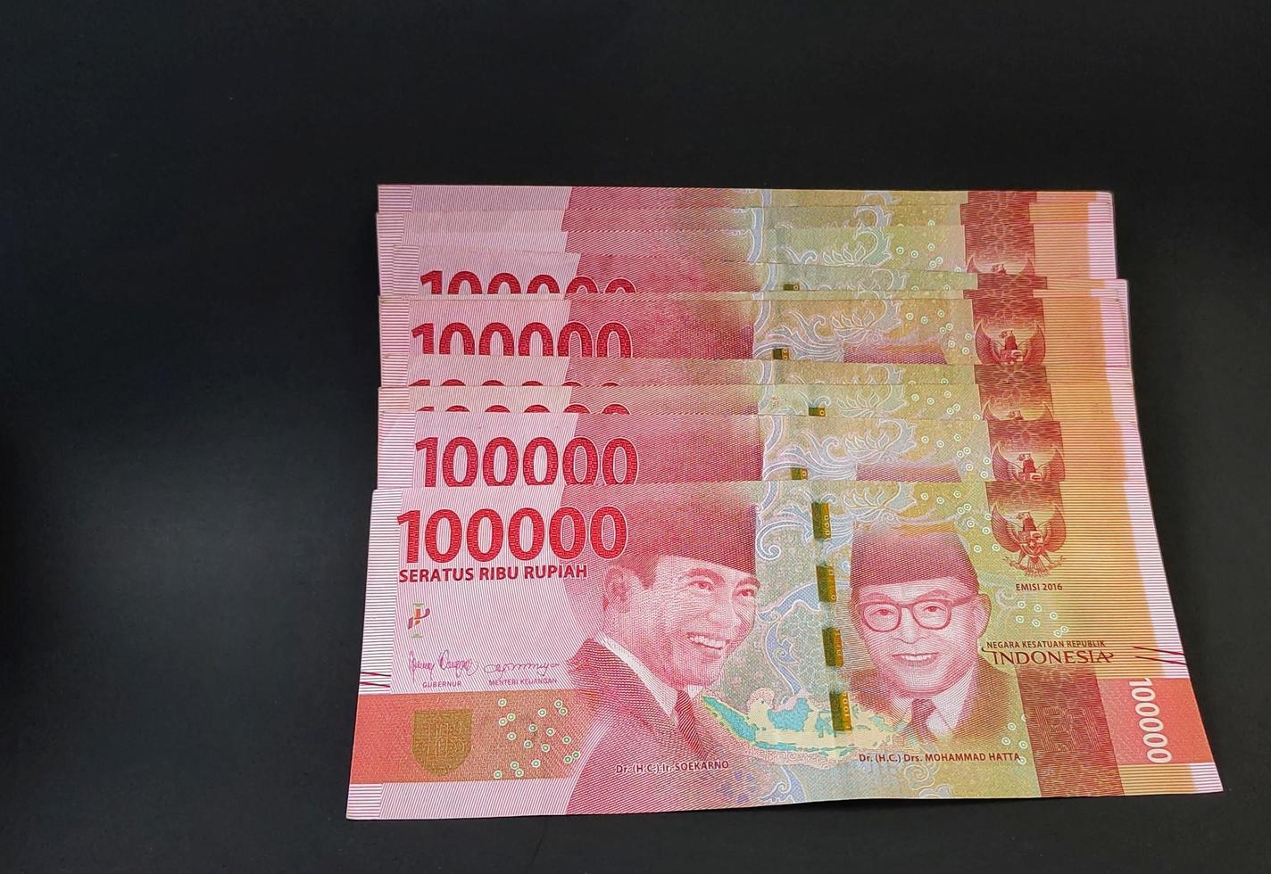 Rupiah banknotes arranged in a neat pattern photo