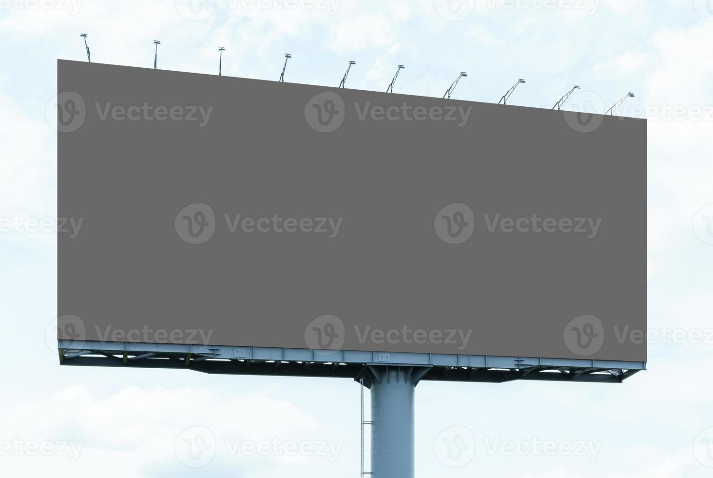 Outdoor billboard on blue sky background with clipping path photo