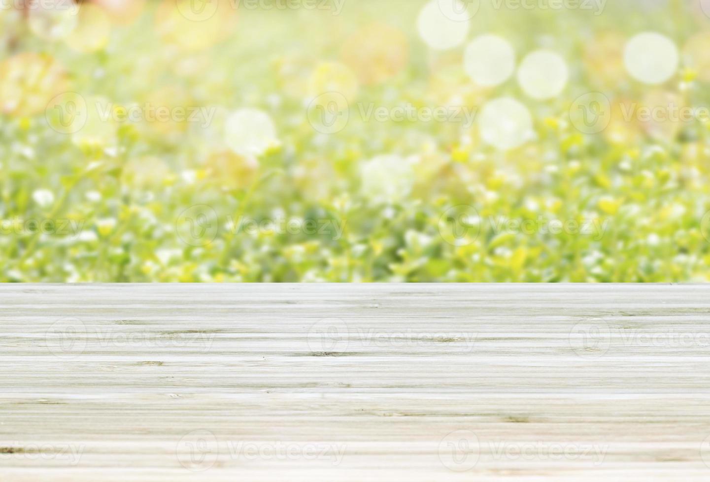 Template empty top table view with green leaf and bokeh light blur effect background photo