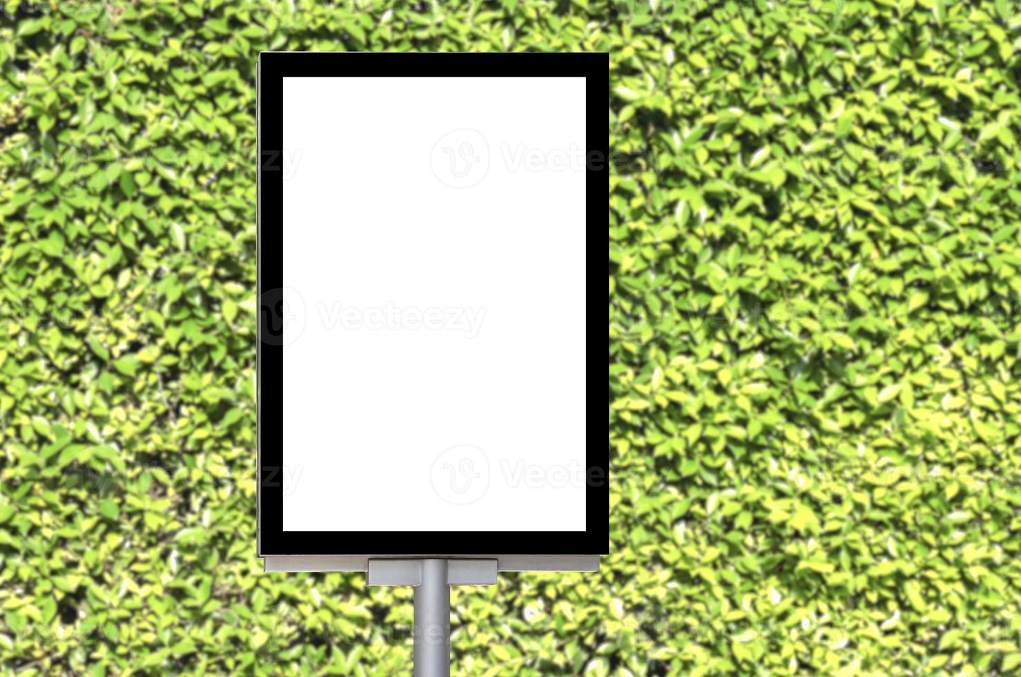 Outdoor pole billboard with mock up white screen on green leaf natural background and clipping path photo