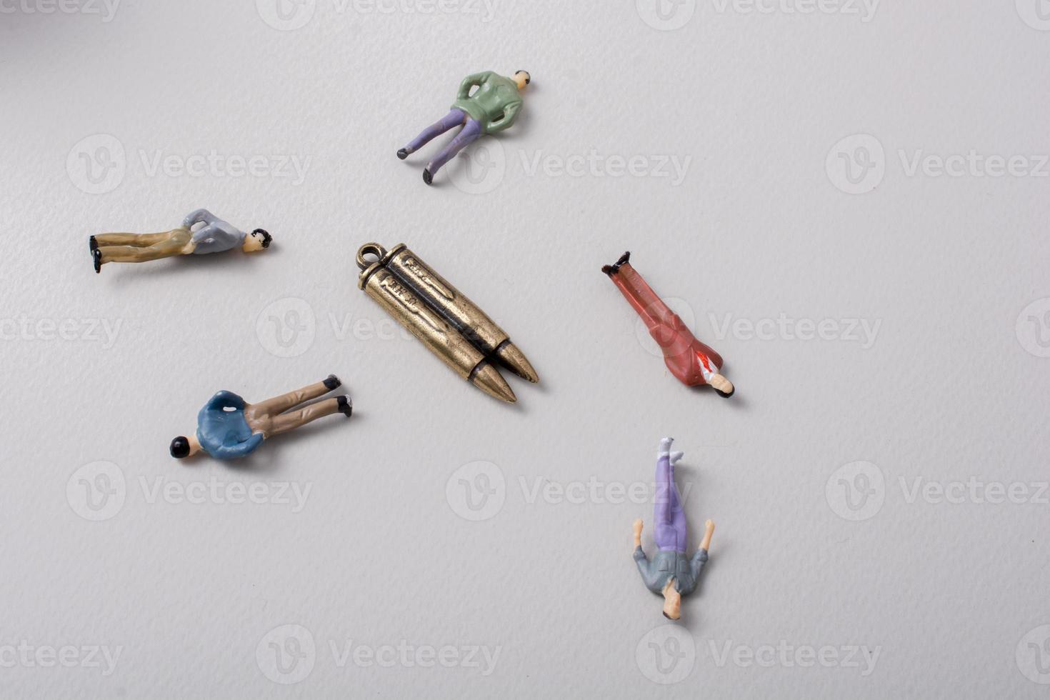 Men figurine around Bullet as Conceptual against the war photo