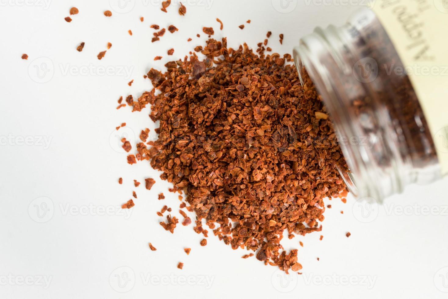 Aleppo Peppers Spilled from a Jar photo