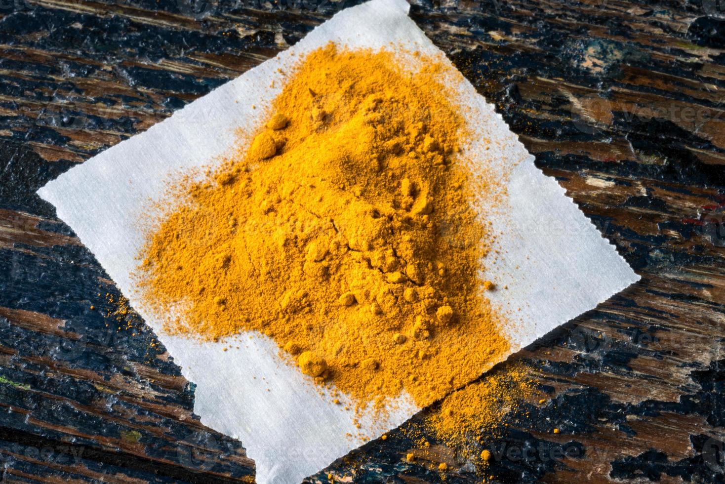 Ground Turmeric on Parchment Paper 14843455 Stock Photo at Vecteezy