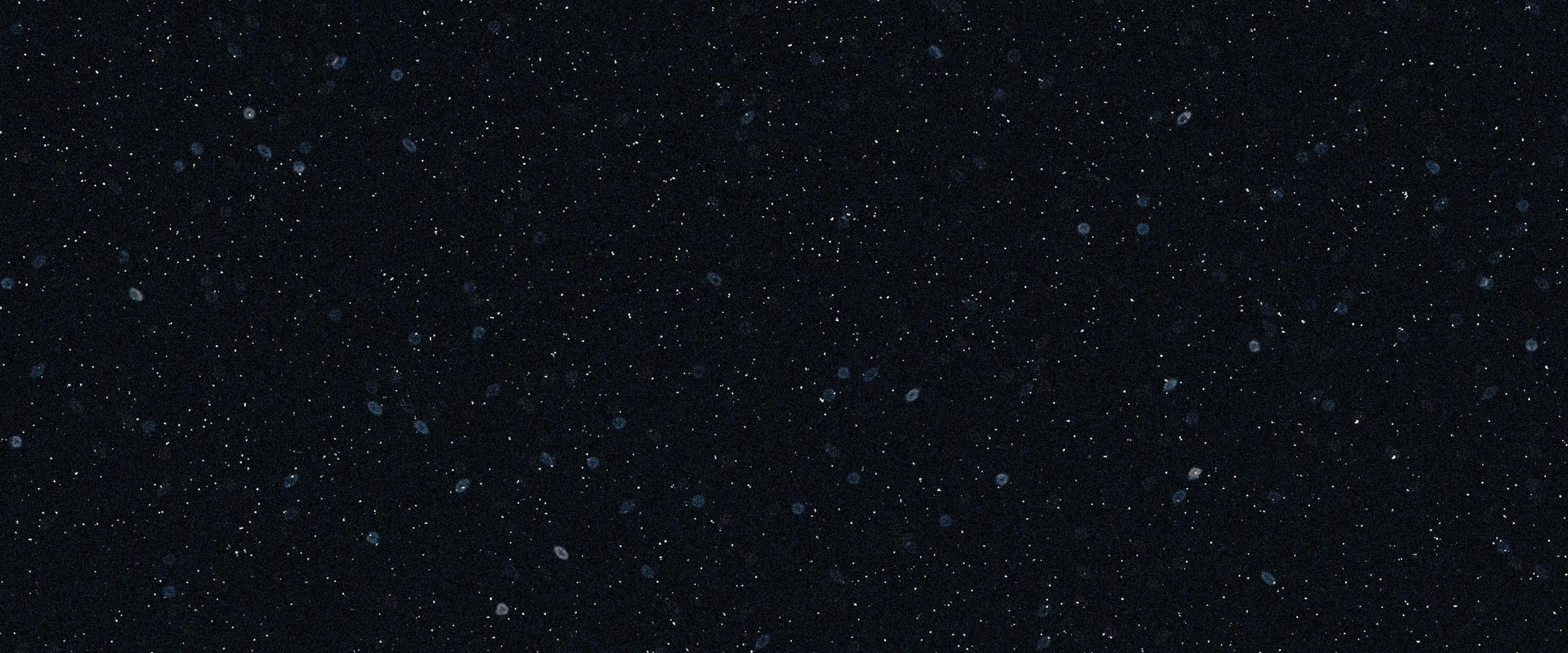 Snowfall bokeh on black background. Many snowflakes in flying in the air. Winte night snowfall and blizzard of snow at. Blur bokeh light effect creative background. photo