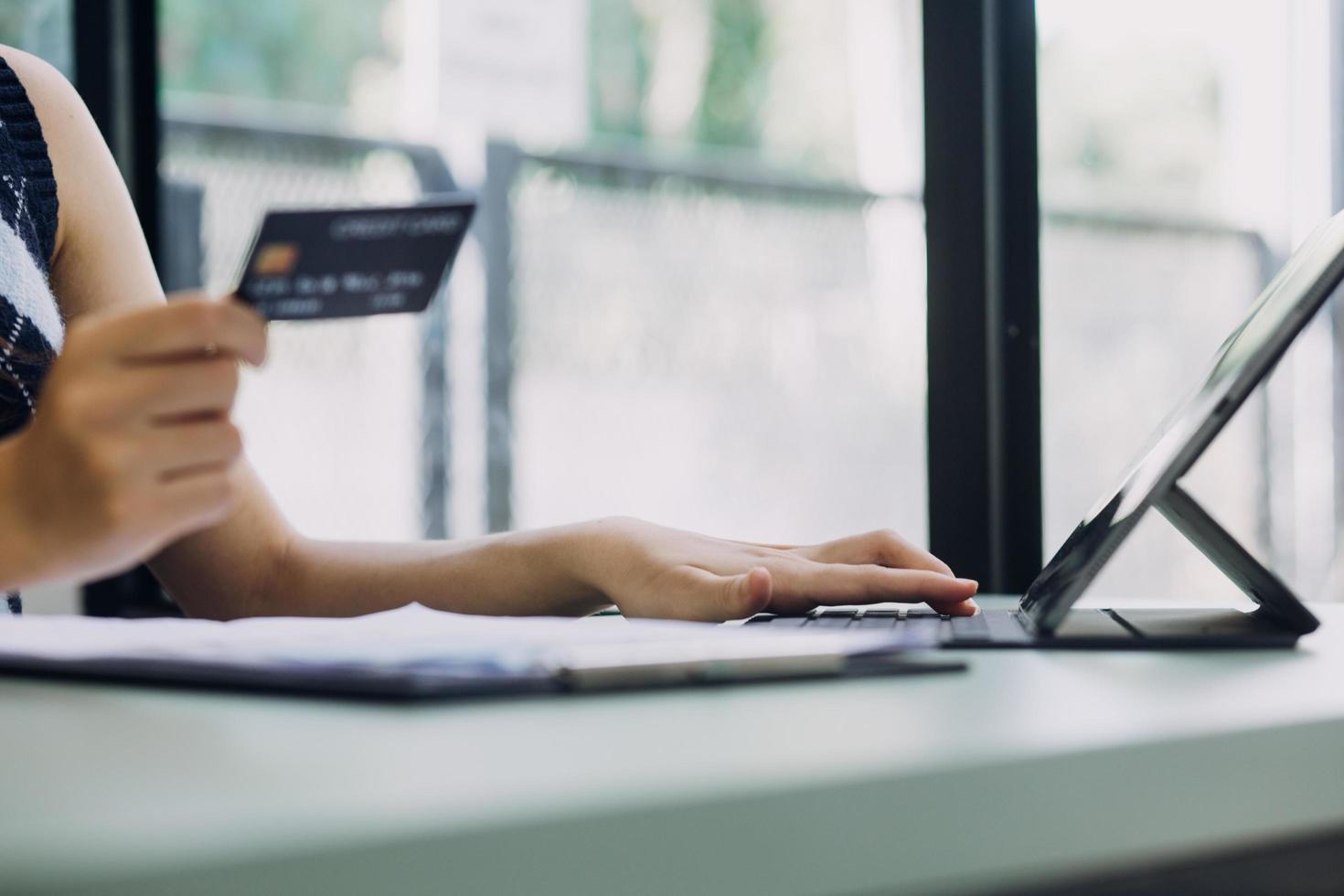 Concept online payment with cradit card. Hand of men using laptop for to payment make online health insurance. photo