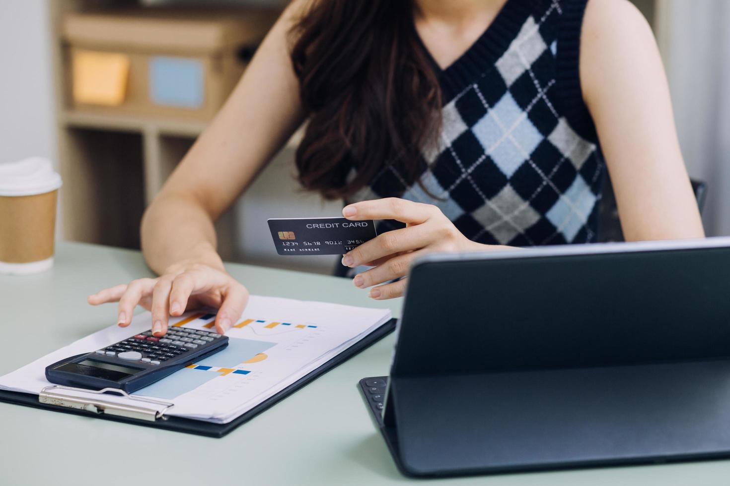 Woman hands holding and using cradit card for shopping online. photo