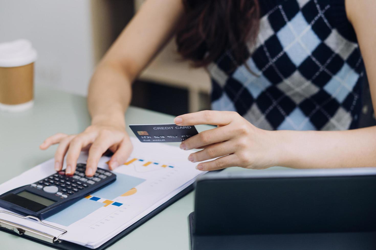 Woman hands holding and using cradit card for shopping online. photo