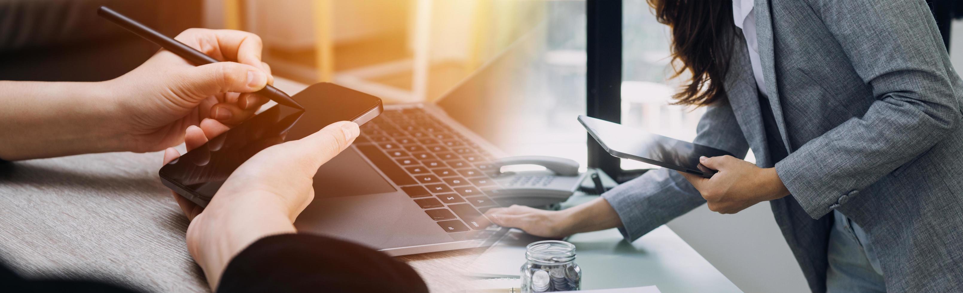 Business team present. Photo professional investor working new startup project. Finance meeting.Digital tablet laptop computer smart phone using, keyboard docking screen foreground,filter