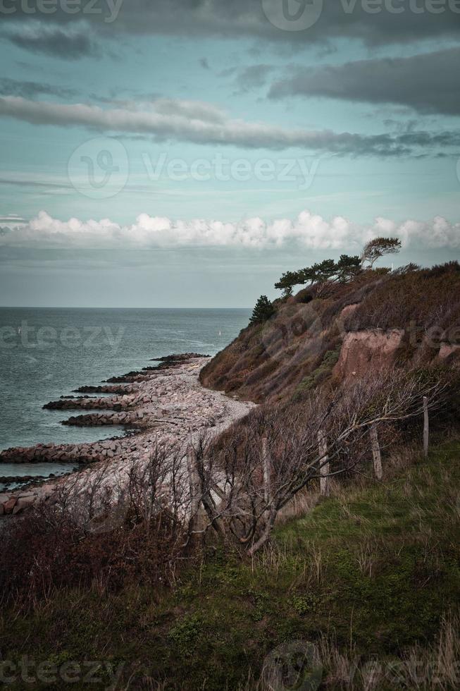 Hundested, Denmark on the cliff overlooking the sea. Baltic Sea coast, grassy photo