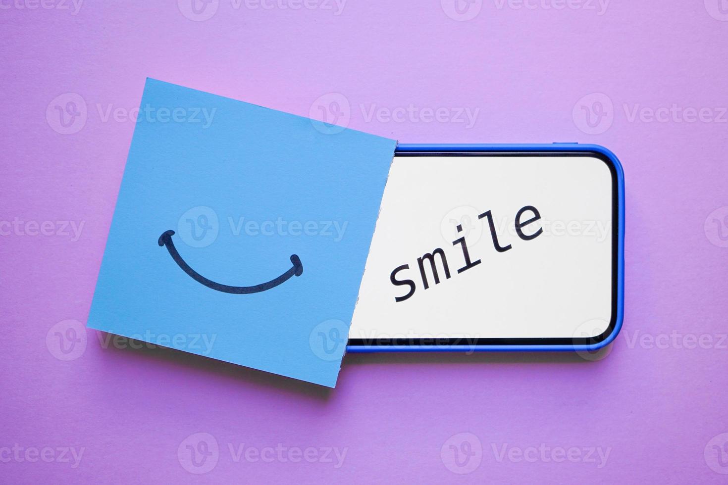 smile word on the pink background, feelings and emotions photo