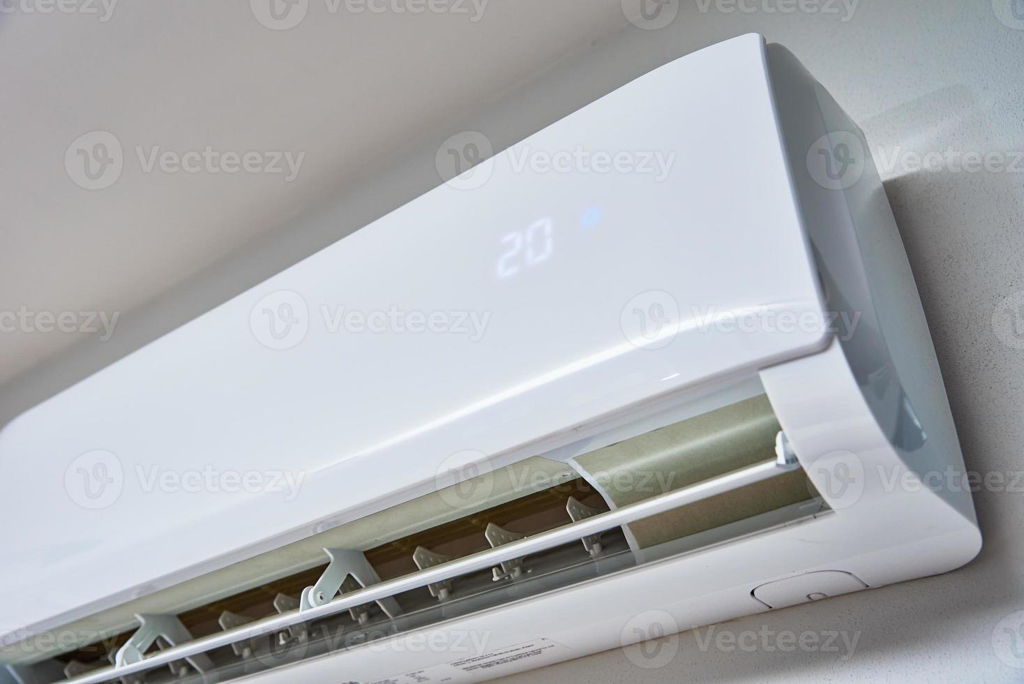 Air conditioner hanging on the wall, close up photo