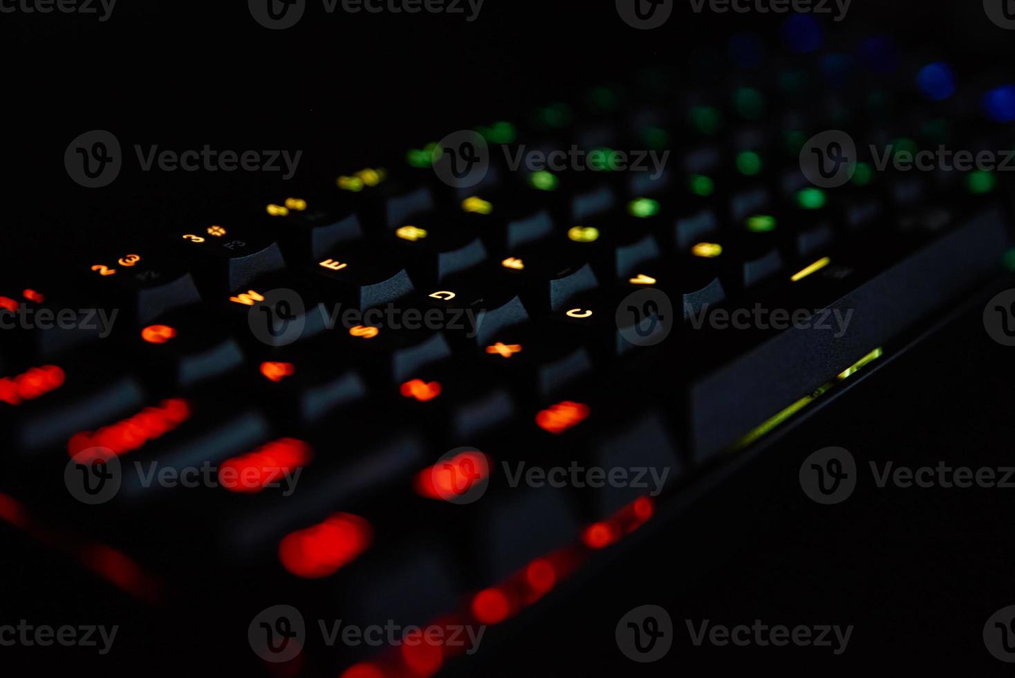 Gaming rgb keyboard on dark background photo