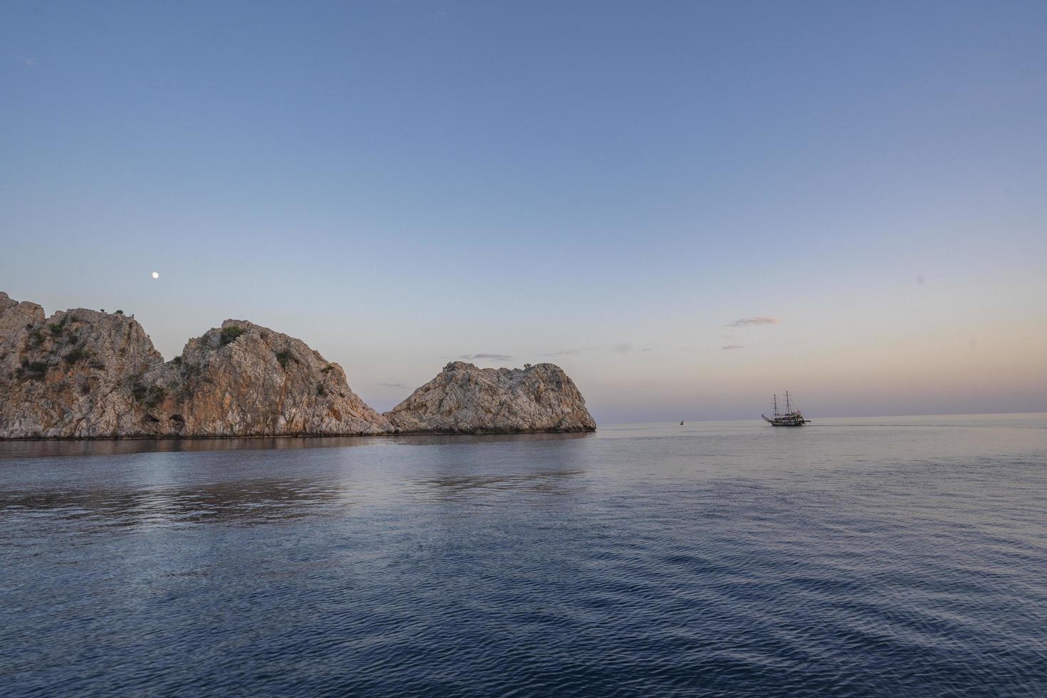 Stone and island view from the sea. sightseeing tour by boat photo