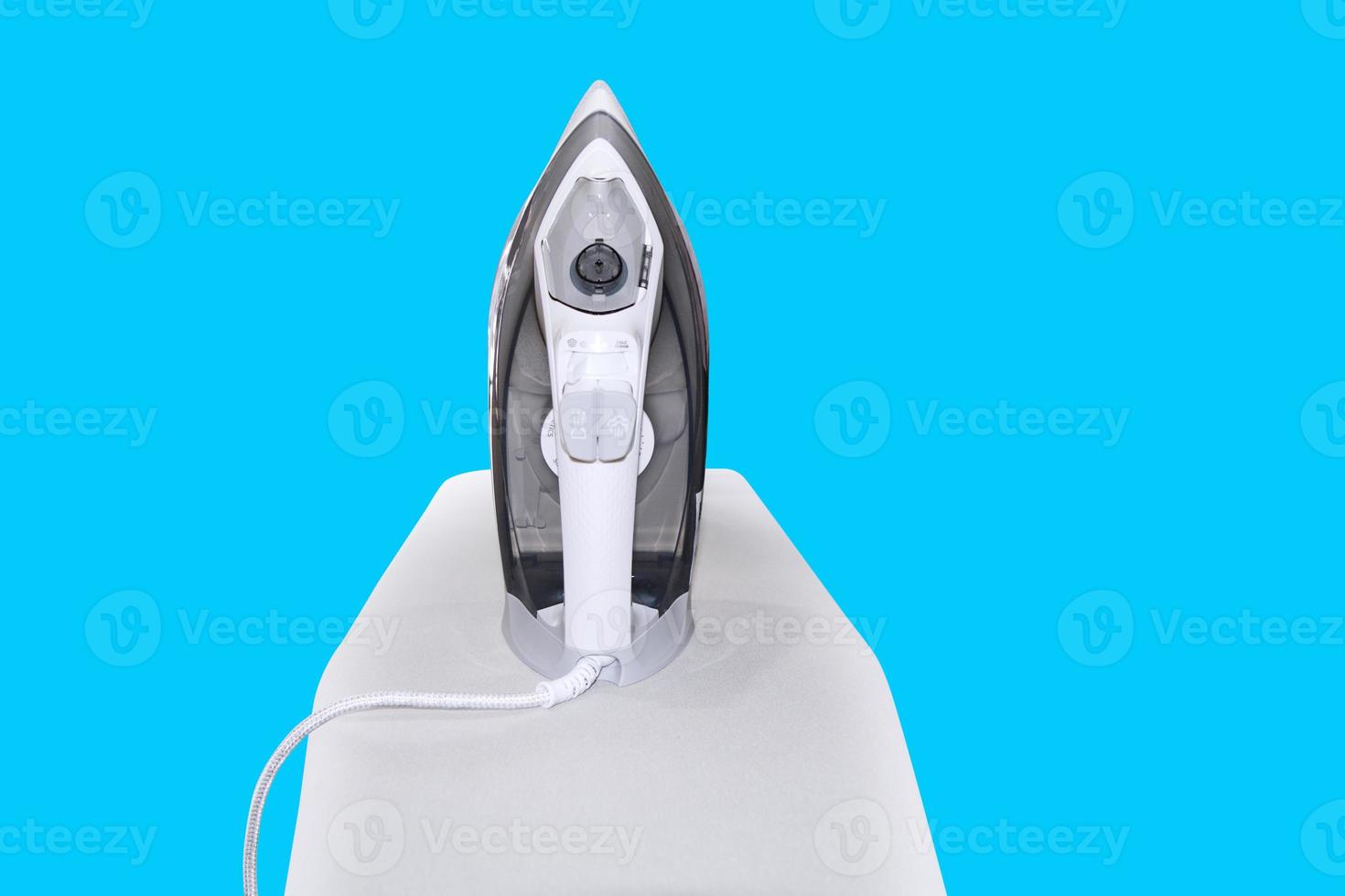 electric iron on ironing board Housework and housekeeping photo