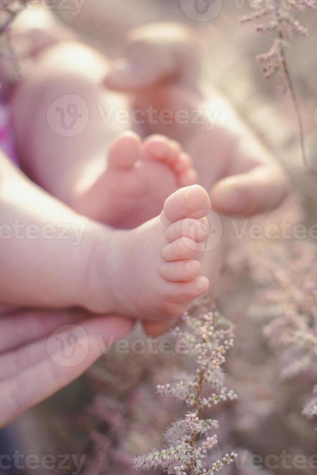 Close up barefooted newborn concept photo