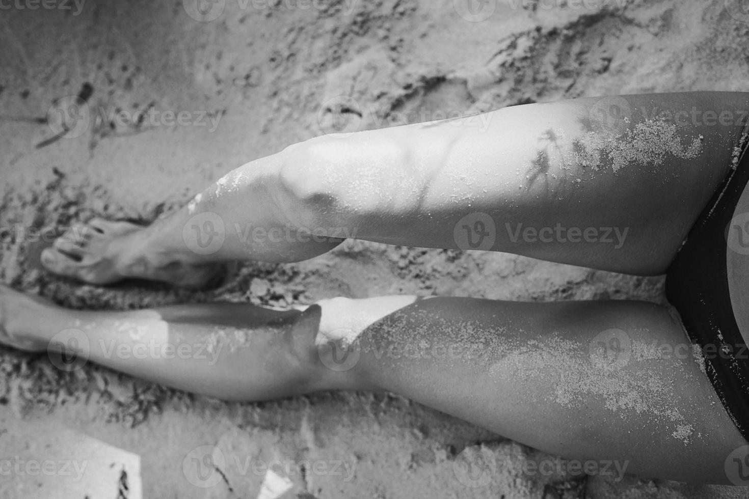 Close up lady with naked legs monochrome concept photo