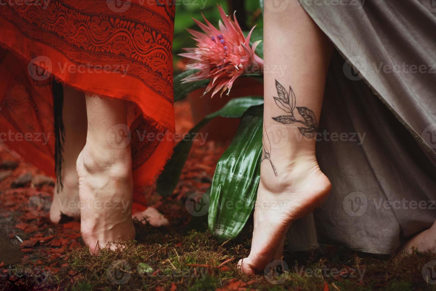 Close up female feet with tattoo concept photo