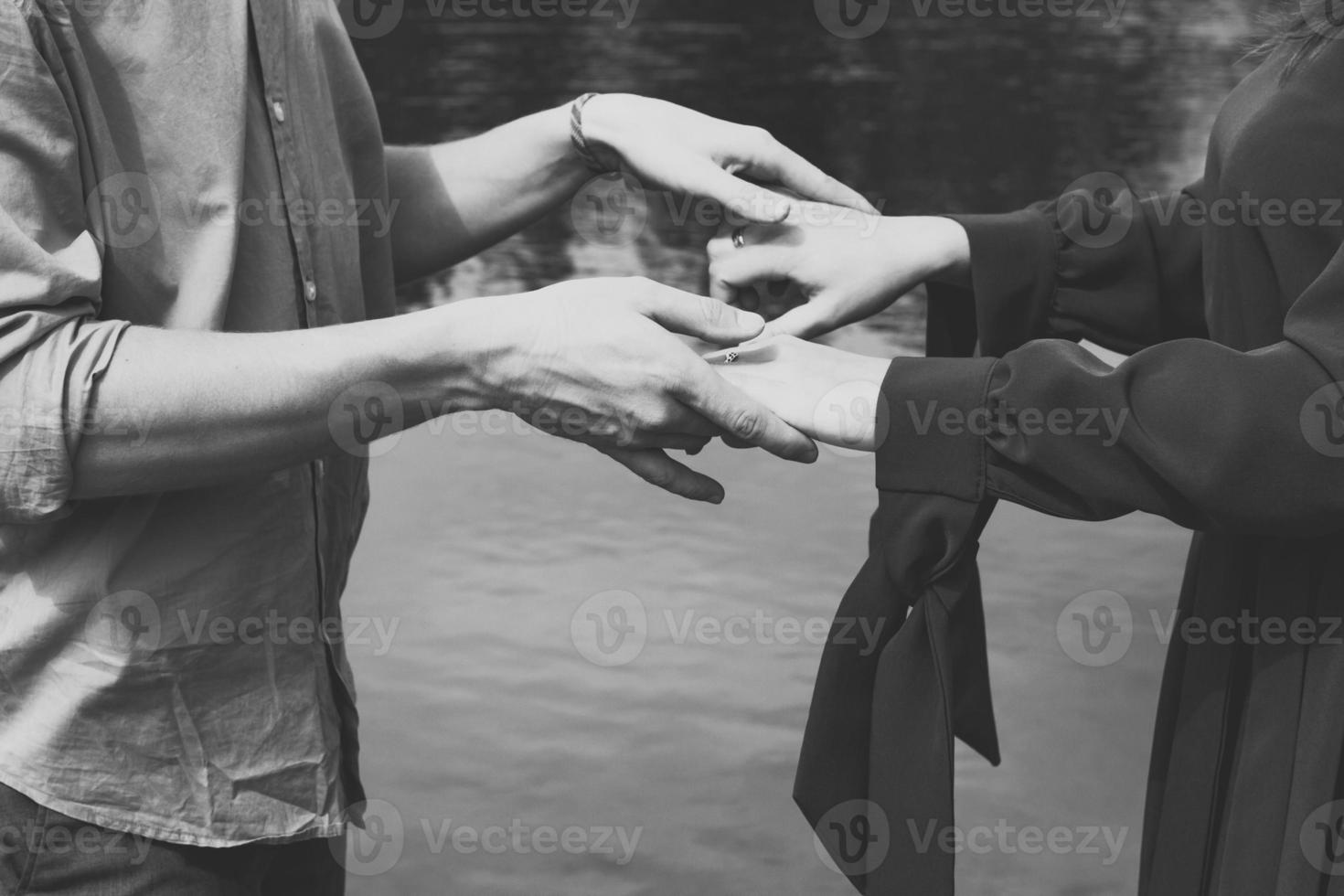 Close up partners holding hands monochrome concept photo