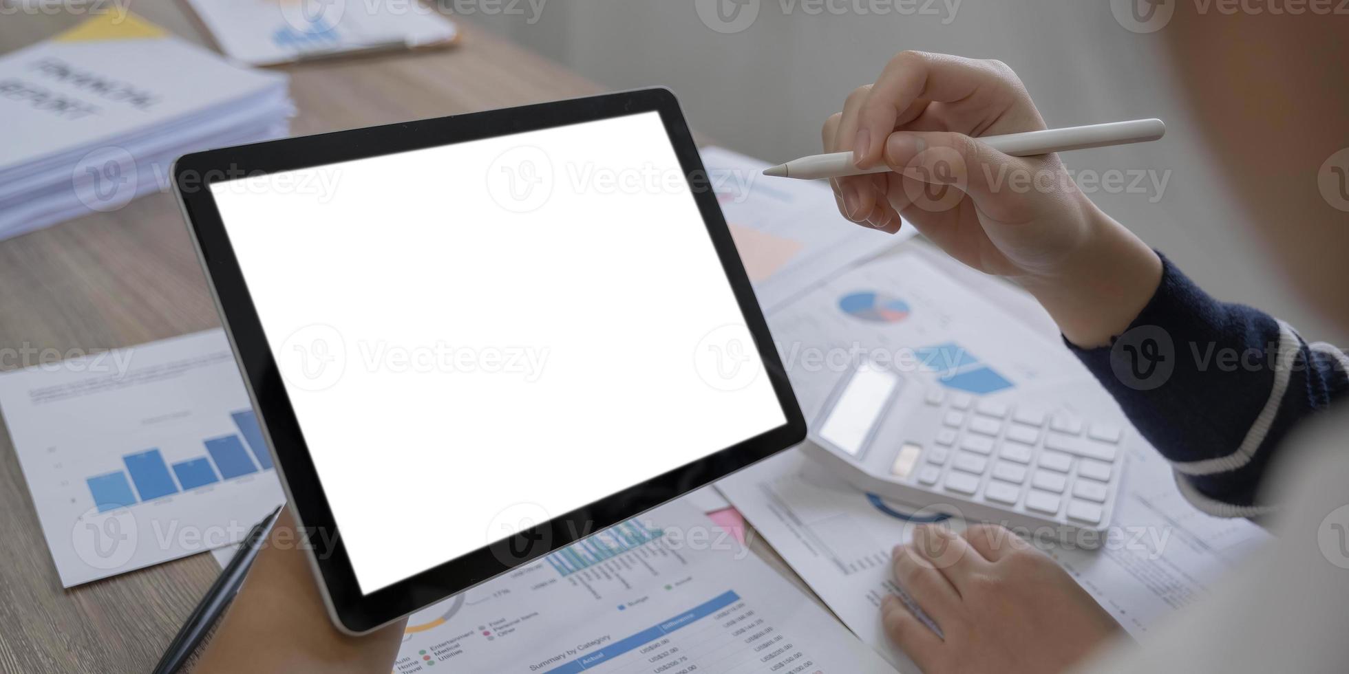 Mockup image of a woman holding digital tablet with blank white desktop screen photo