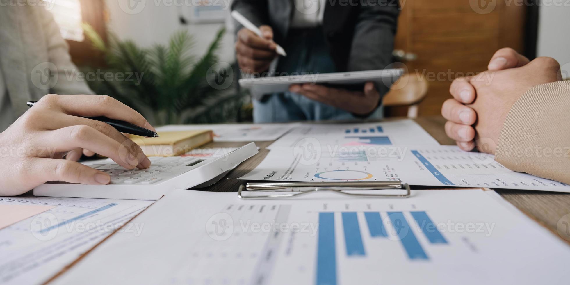 Business financial, accountant discussing with partner are meeting to audit finance planning sales to meet targets set in next year. stock market concept. photo