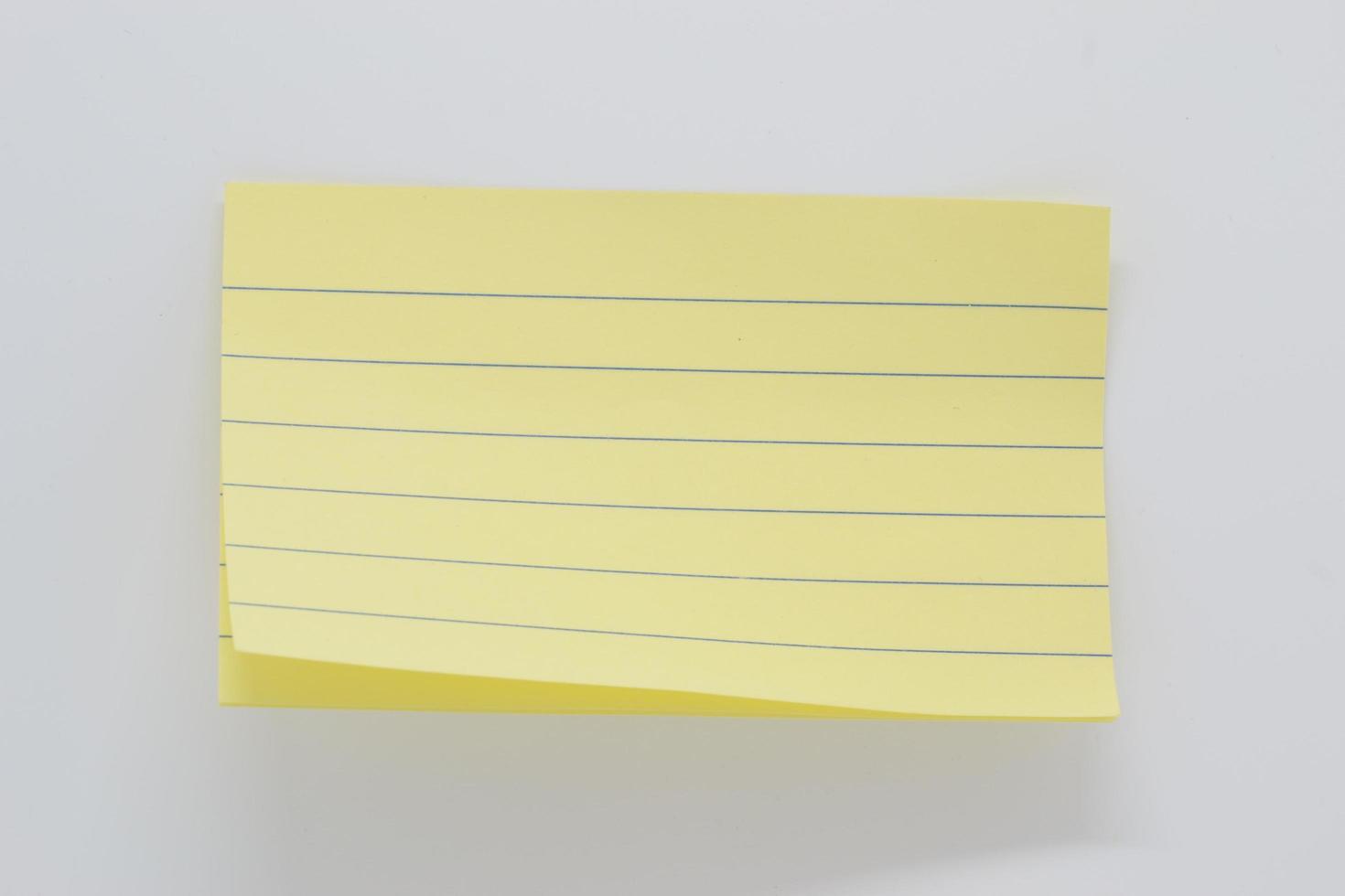 yellow paper with lines for notes, paper background photo