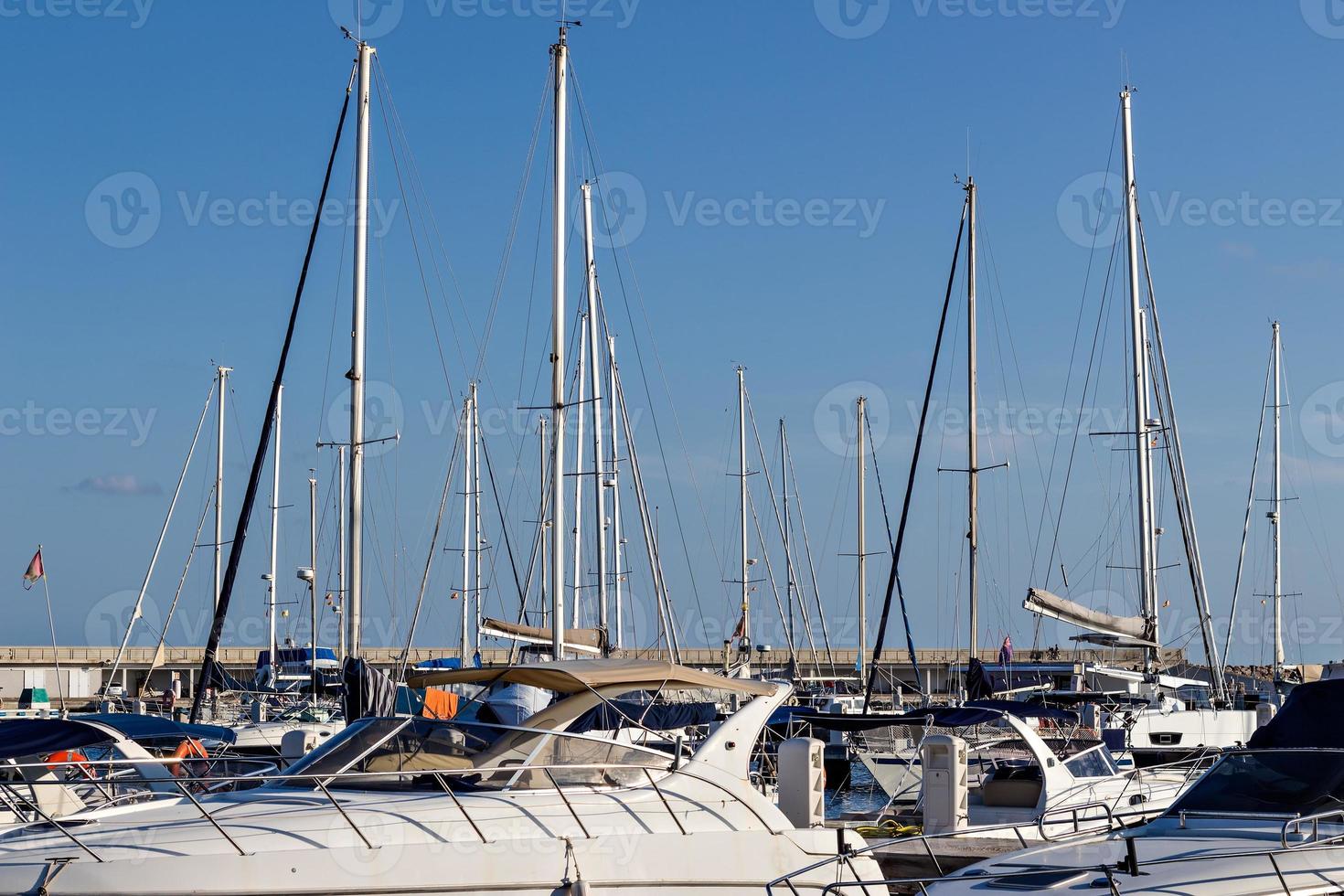 Several boats waiting in the marina. Horizontal image. photo