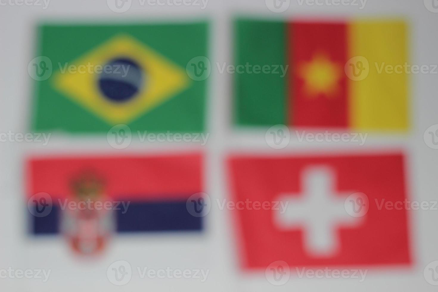 Leather soccer ball with international team flags of the participating countries in the championship tournament isolated on white background. Football equipment competitive game. World cup concept. photo