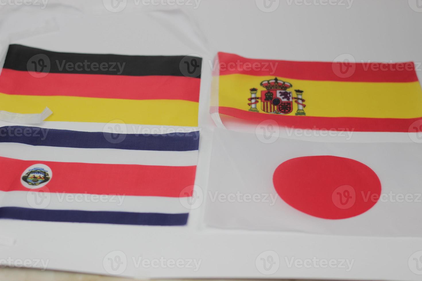 Leather soccer ball with international team flags of the participating countries in the championship tournament isolated on white background. Football equipment competitive game. World cup concept. photo