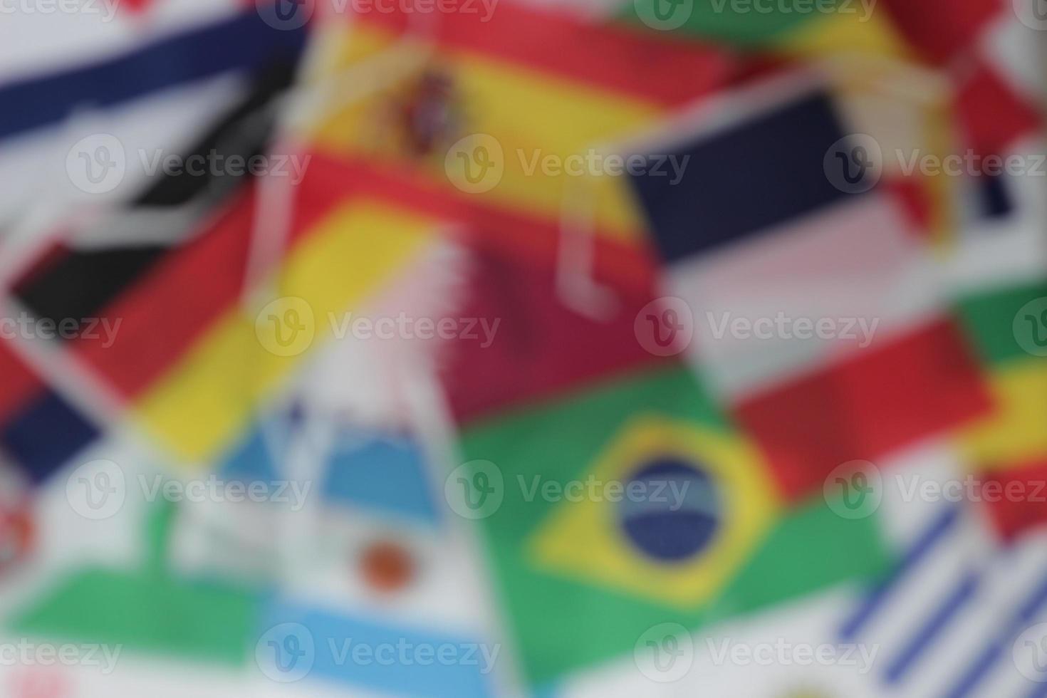 Leather soccer ball with international team flags of the participating countries in the championship tournament isolated on white background. Football equipment competitive game. World cup concept. photo