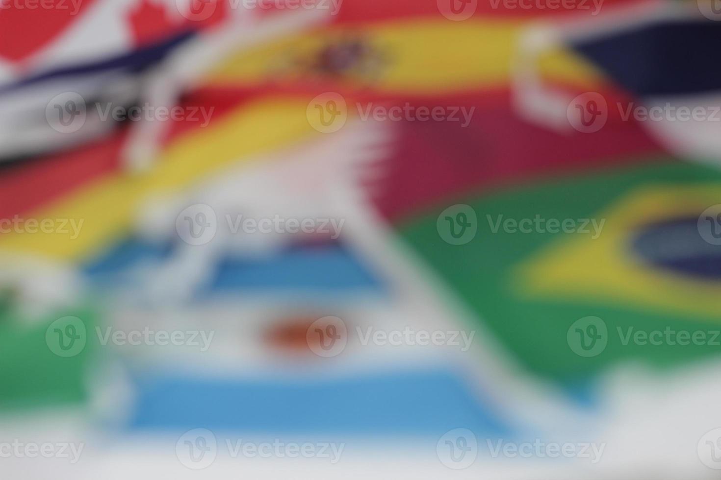 Leather soccer ball with international team flags of the participating countries in the championship tournament isolated on white background. Football equipment competitive game. World cup concept. photo