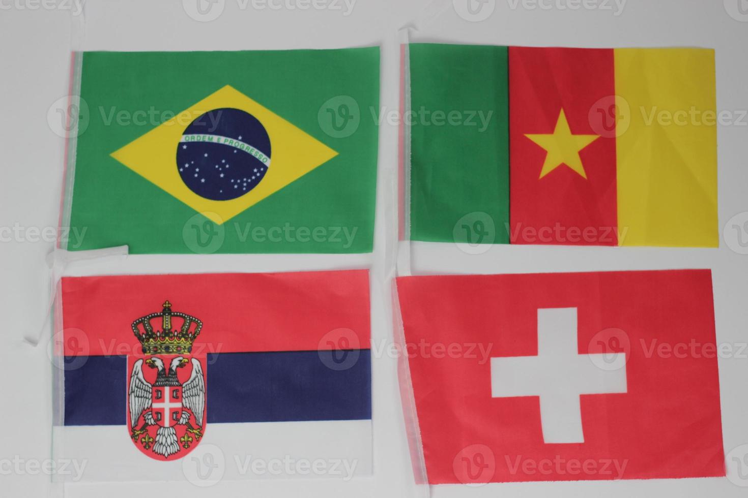 Leather soccer ball with international team flags of the participating countries in the championship tournament isolated on white background. Football equipment competitive game. World cup concept. photo