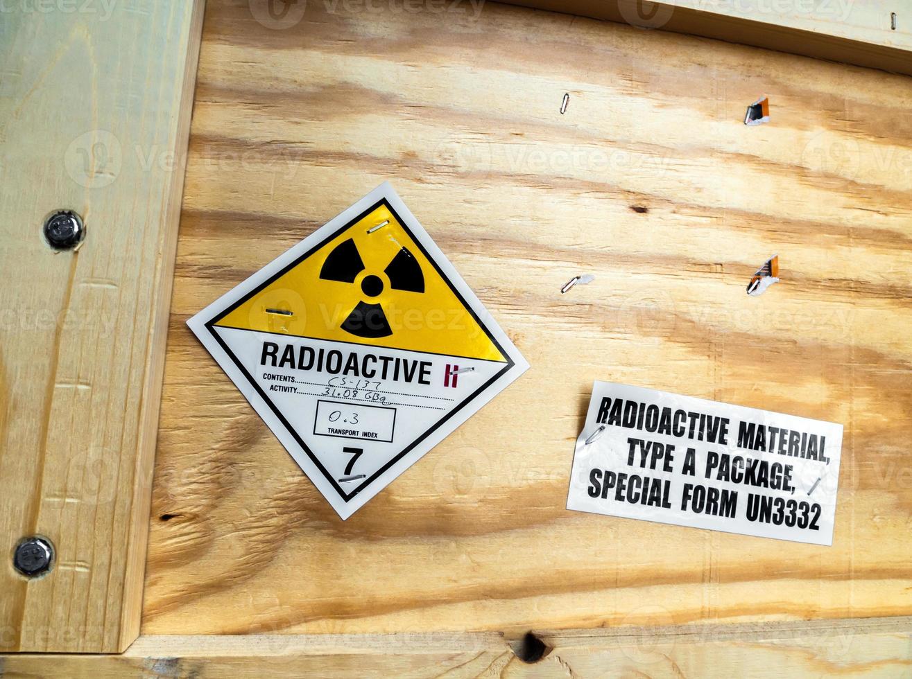 Radioactive material warning label beside the transportation wooden package photo